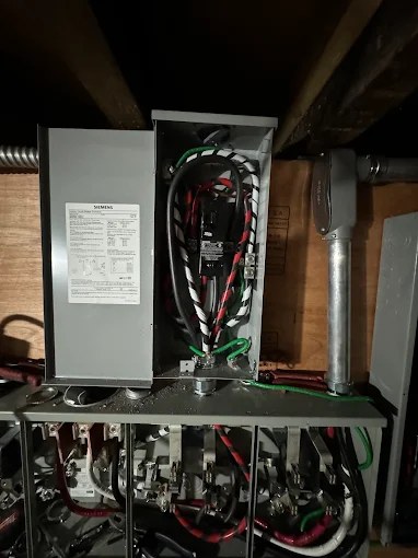 Siemens service disconnect installed above a meter bank