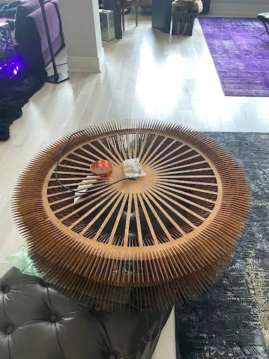 Large sculptural wood ceiling fixture prepped for installation