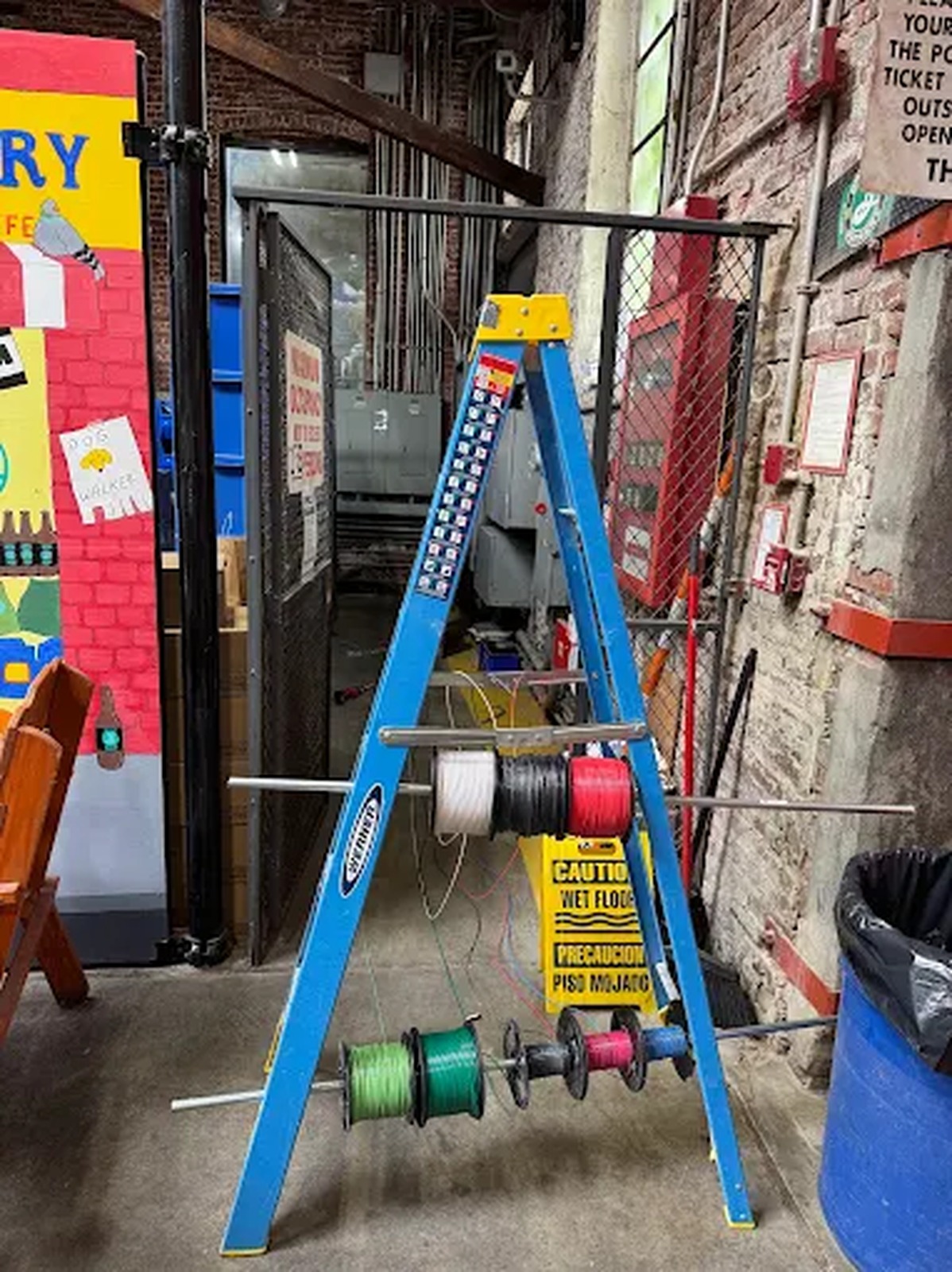 Wire spool cart set up on a commercial rough-in job site