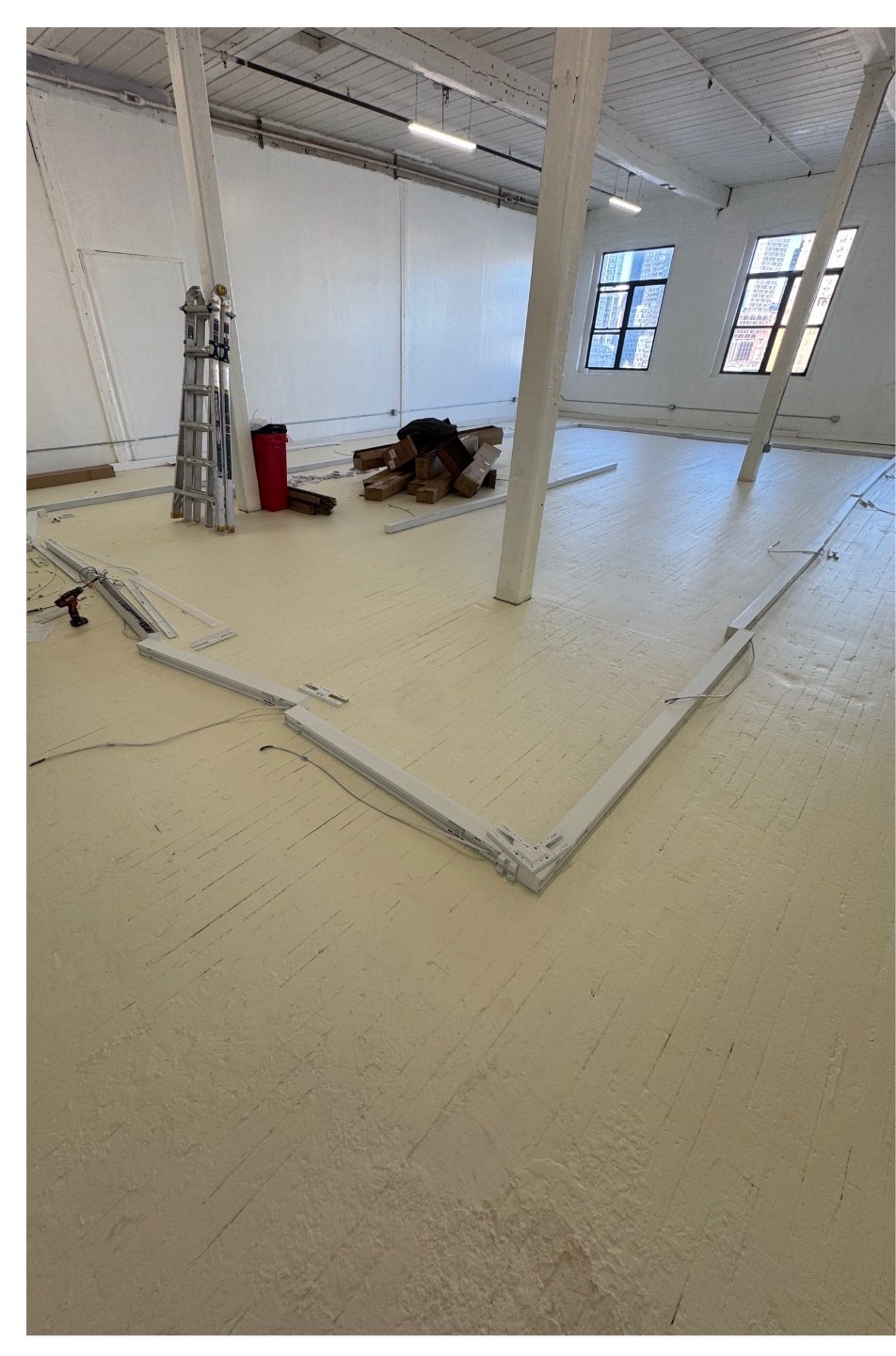Commercial office lighting layout being assembled before ceiling install