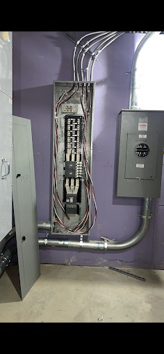 New subpanel and meter with conduit runs installed in a basement