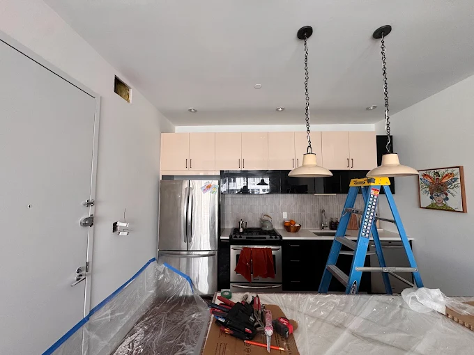 Chain-hung kitchen pendant lights installed over a counter