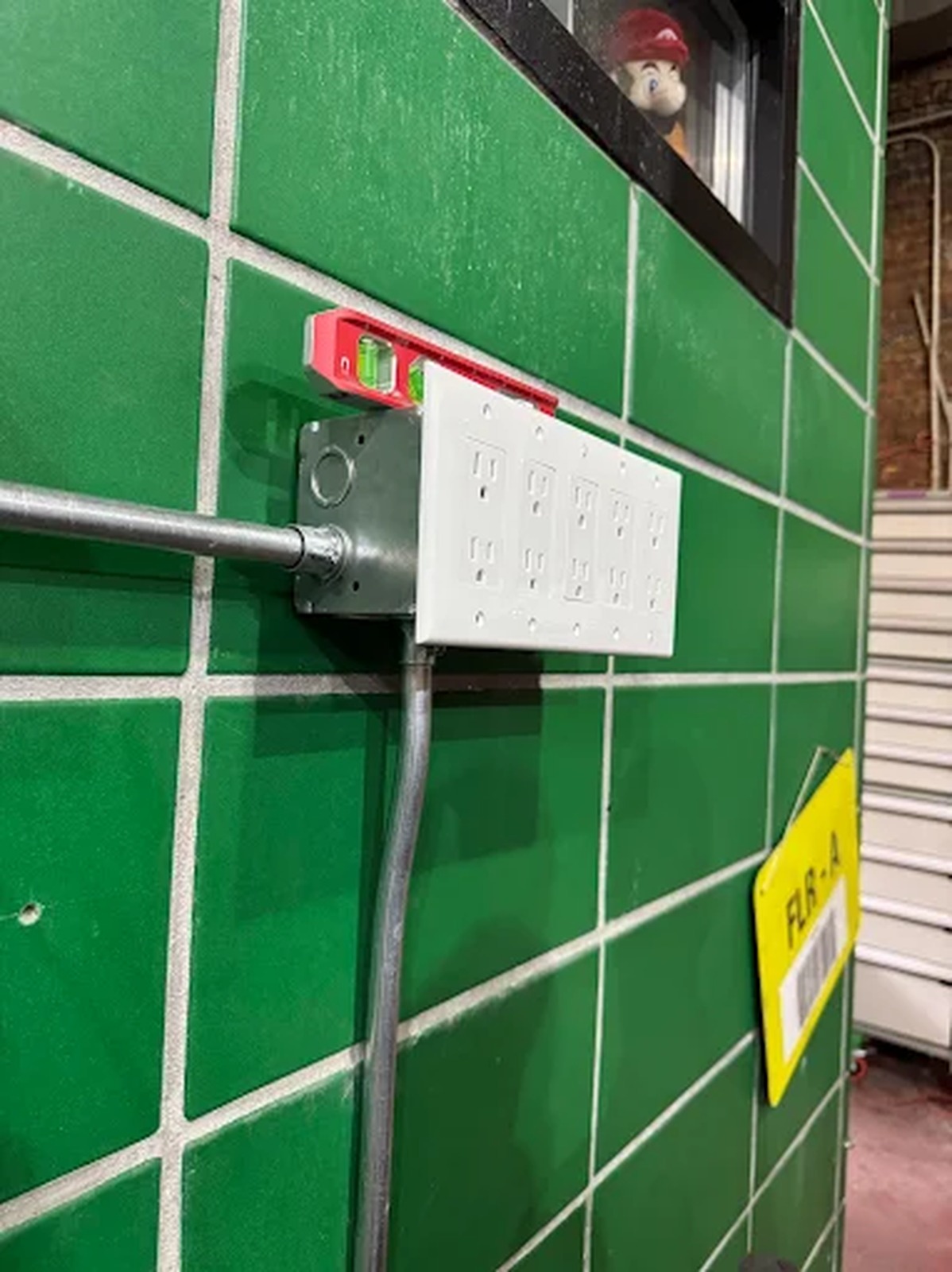Quad receptacle box and conduit installed in a commercial kitchen