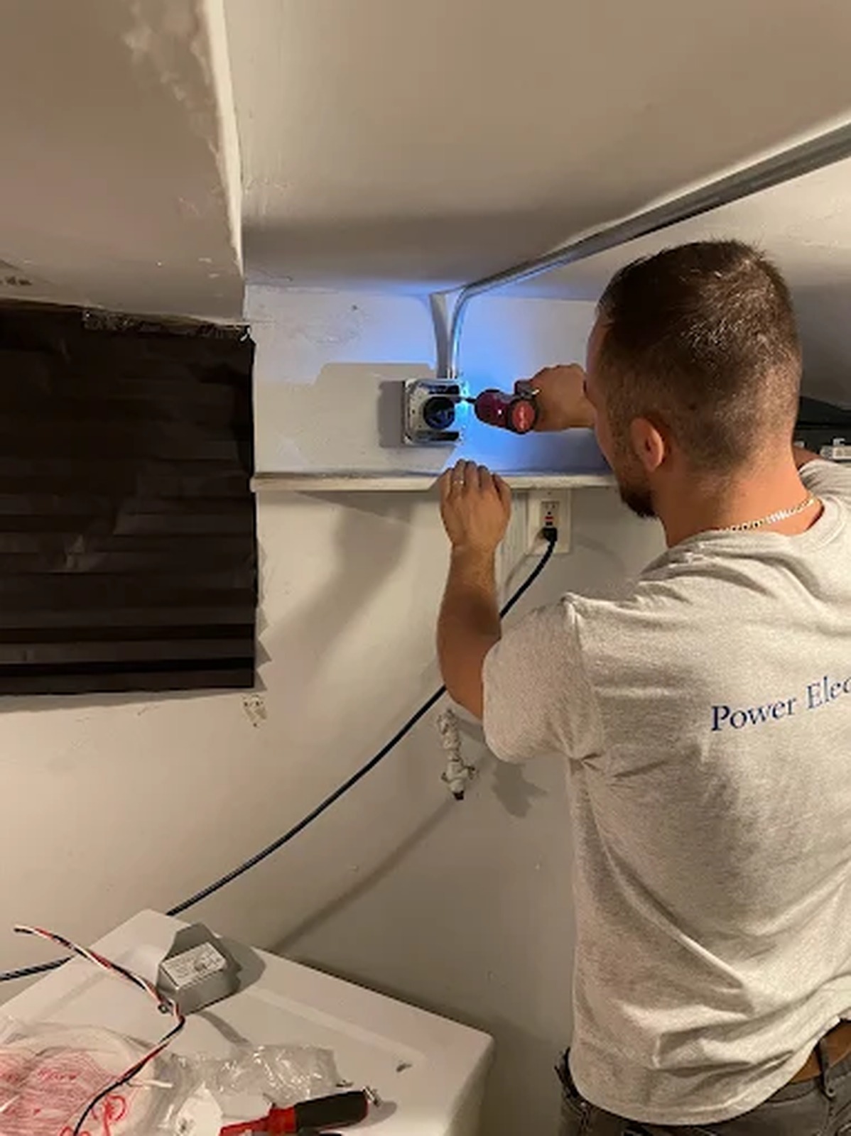 Power Electric NY electrician installing a new outlet and switch box