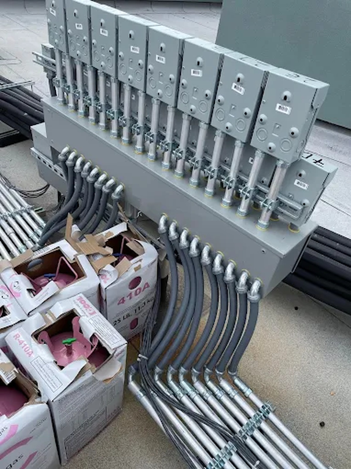 Bank of rooftop disconnect switches with conduit whips installed